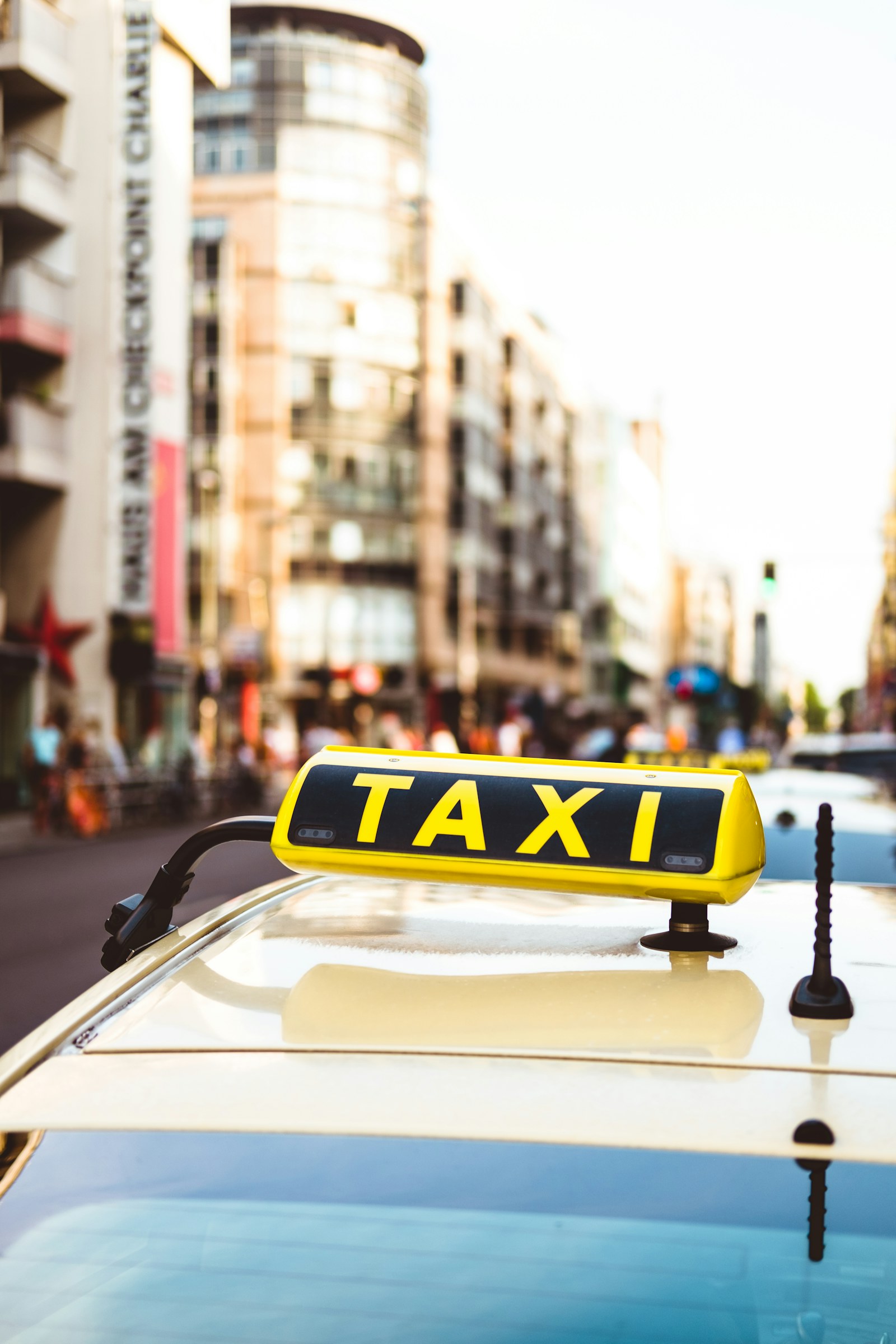 Passenger paying by card on a terminal in a taxi